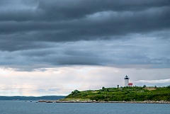 Storm Clouds Lifting Over Tarpaulin Cove Lighthouse on Island